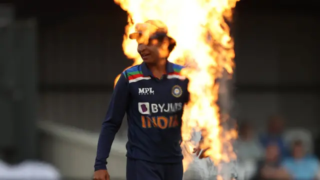 9 July: Harmanpreet Kaur of India walks out to field in Northampton at the women's first T20 international between England and India