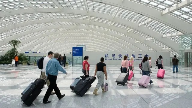 Travellers arrive at Beijing Capital International Airport