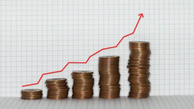 Gráfico con monedas para representar la inflación.