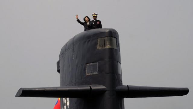 Taiwan President Tsai Ing-wen waves from a Duch-made Sea Tiger submarine at the Tsoying navy base in Kaohsiung, southern Taiwan on March 21, 2017. Taiwan formally launched an ambitious project to build its own submarines as the island faces growing military threats from China as relations deteriorate. / AFP PHOTO / SAM YEH (Photo credit should read SAM YEH/AFP/Getty Images)