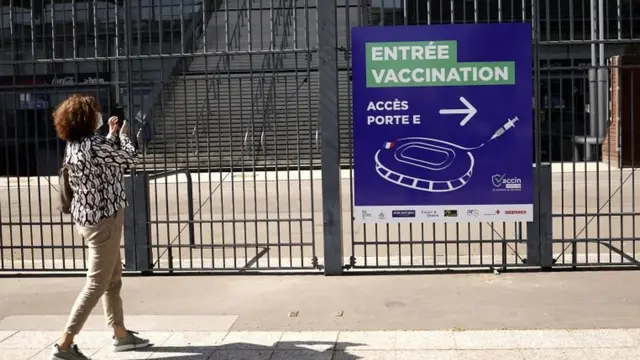 Signs of the entrance of a Covid-19 vaccination centre are installed outside France's national stadium, Stade de France, near Paris, France, on 31 March 2021