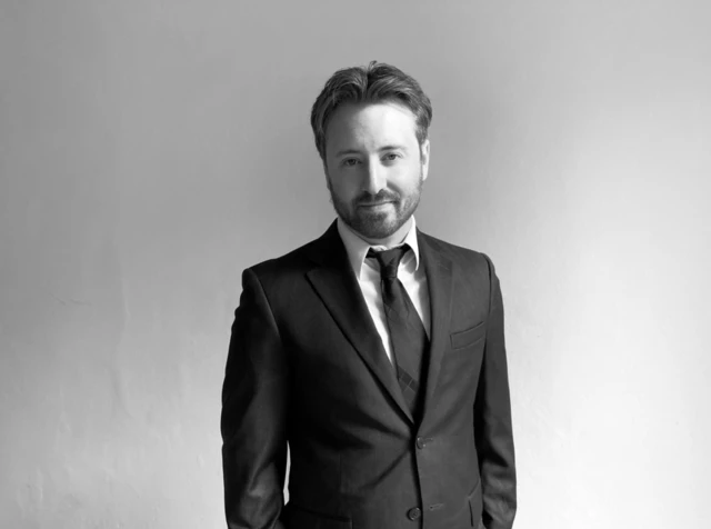 صورة لأندرو داي، كبير المحررين في مجلة الأمريكي المحافظ