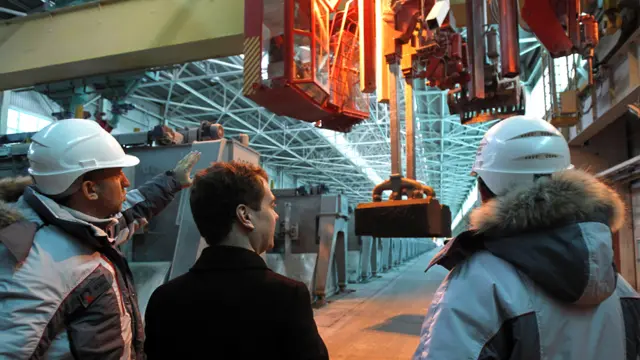 SAYANOGORSK, RUSSIA. MARCH 11, 2011. Russian president Dmitry Medvedev (C) and RUSAL CEO Oleg Deripaska (L) visit "Rusal Sayanogorsk" plant