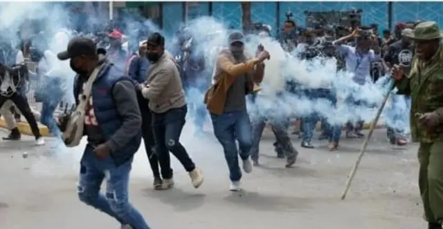 Protesters with tear gas