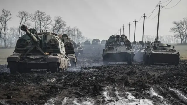 Russian armoured vehicles stand on the road in Rostov region, Russia, 22 February 2022