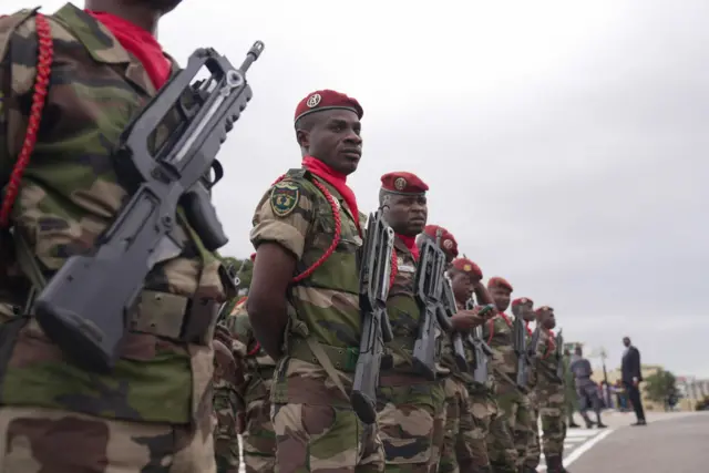 Dem broadcast di ceremony live for Gabon TV plus ontop all online platforms. Former ministers from di goment wey dem just takeover show for di event, but pipo bin boo dem. General Nguema inauguration na di latest for military takeover across West and Central Africa. Gabon na di number six French speaking kontri wey military don take over inside di last three years as dia former colonial master France, still dey try keep dia control for di continent. Africa Union bin suspend Gabon afta di coup, wey United Nations and France don condemn. For di event, dem bin also do military parade for di presidential palace for di capital, Libreville.