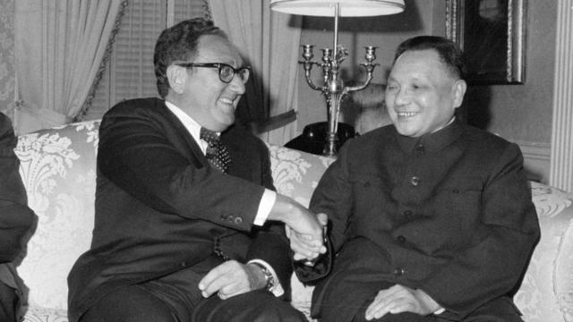 (Original Caption) New York: US Secretary of State Henry Kissinger chats with Vice Premier Deng Xiaoping of China at a dinner here 4/14. Deng is the highest-ranking official of the People's Republic of China ever sent to the US. 4/15/1974