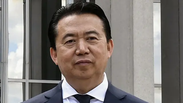 INTERPOL President Meng Hongwei poses during a visit to the headquarters of International Police Organisation in Lyon