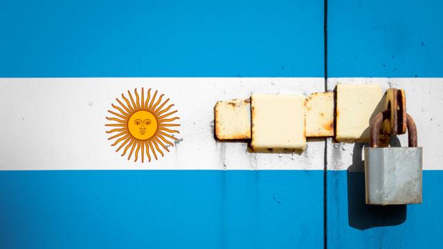 A locked door painted with the Argentina flag