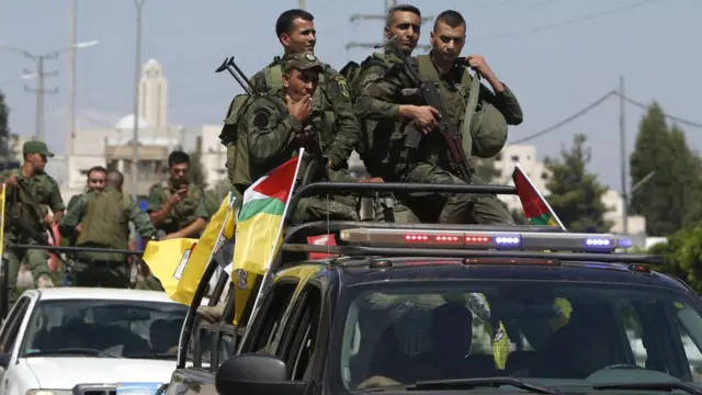 Members of the Palestinian Authority security forces patrol the West Bank city of Nablus on 19 August 2016