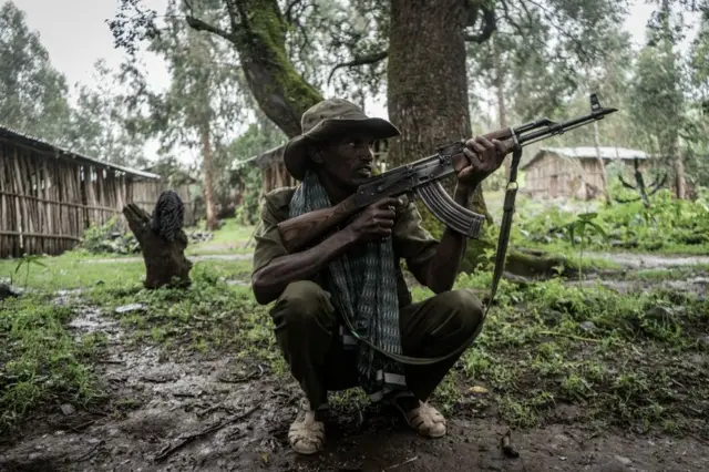 An Amhara militia member poses for a photograph near the village of Chenna, 95km north-east of the city of Gondar.