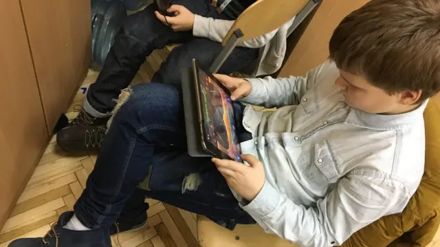 boys with electronic devices