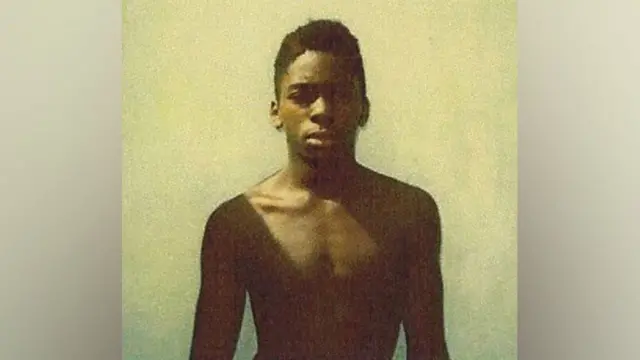 ማርክ ጎርደን ኣብ 1989 ኣብ እዋን ክእሰር እንከሎ ዝተሳእሎ ምስሊ