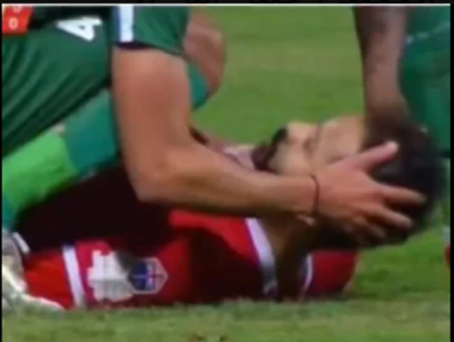 Player Ahmed Refaat falls on the field