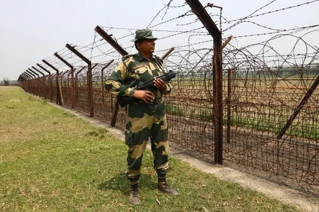 Indian Border Security Force (BSF) soldier patrolling at the near Petrapole Border outpost at the India-Bangladesh Border