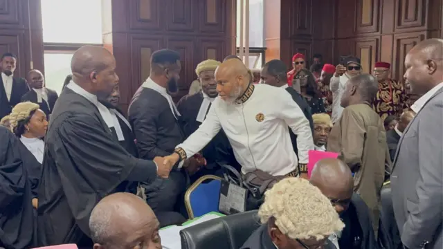 Nnamdi Kanu dey shake hands wit lawyer