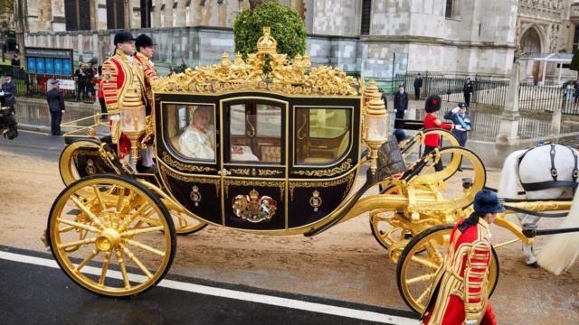 Britain's King Charles III and Camilla, the Queen Consort, travel in the Diamond Jubilee State Coach towards Westminster Abbey to their coronation ceremony, in London, Britain May 6, 2023.