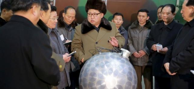 North Korean leader Kim Jong Un inspects what is claimed to be a miniaturized nuclear weapon ( KCNA handout)