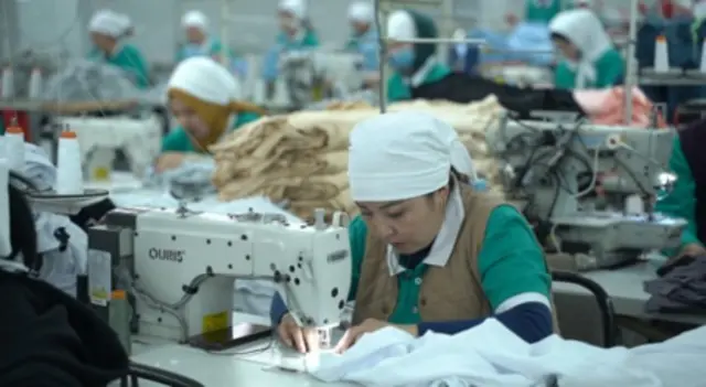 Тигүүчү аял