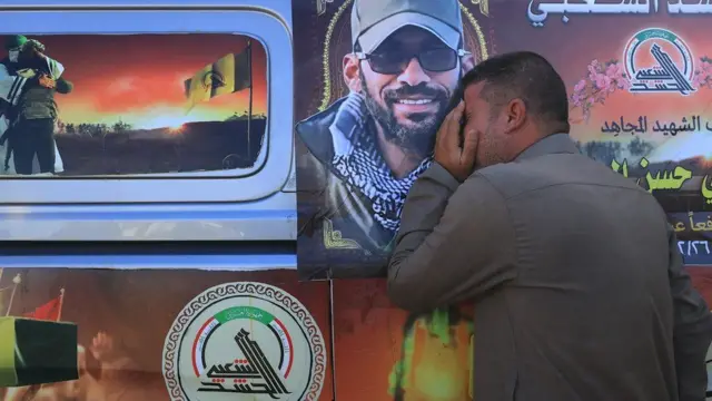 People attend the funeral ceremony of the member of Popular Mobilisation Forces (PMF, Hashd al-Shaabi) militia who was allegedly killed in a US airstrike in the Iraqi city of Babylon on 26 December 2023, in Baghdad, Iraq