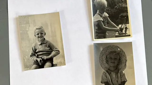 A collage of three black and white photographs of a little boy with blonde hair. In the one on the left he is smiling at the camera, top right he is playing a game outside and in the bottom right he is smiling, wearing a sun hat.