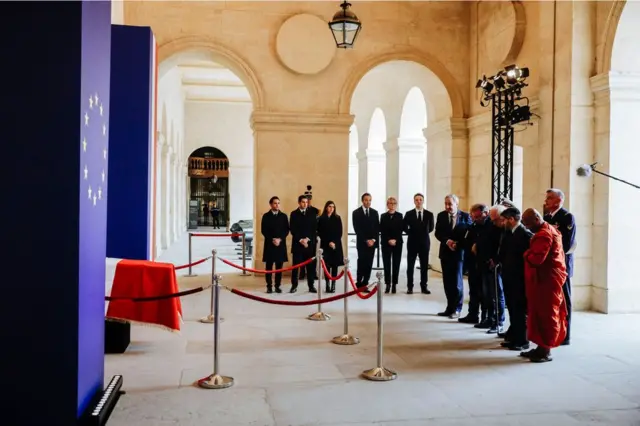 Religious authorities pay their respects at the coffin of late French President Jacques Chirac on 29 September 2019