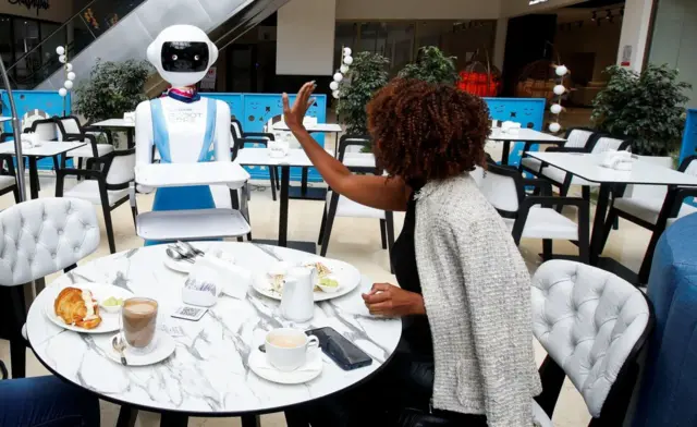 A customer thanks a robot