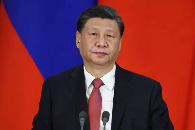 Xi