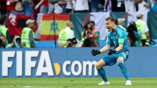 Goalkeeper Igor Akinfeev of Russia celebrates after making the winning safe in the penalty shootout of the FIFA World Cup 2018 round of 16 soccer match between Spain and Russia in Moscow, Russia, 01 July 2018.