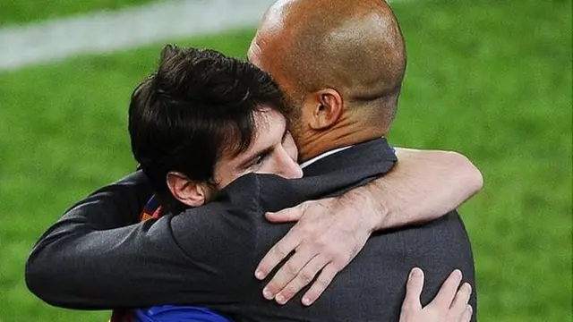 Lionel Messi hugs Pep Guardiola