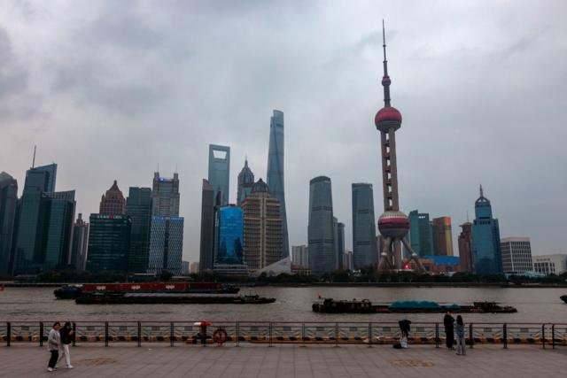 Three cargo ships sail on Huangpu River in China's financial centre Shanghai