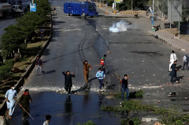 Supporters of Pakistan's former Prime Minister Imran Khan shout slogans during a protest after Khan's arrest, in Karachi, Pakistan, May 9, 2023.