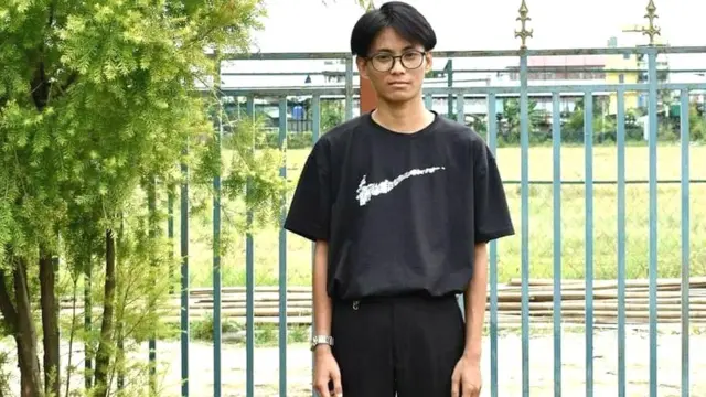 Lulu Mangang wearing a black t shirt