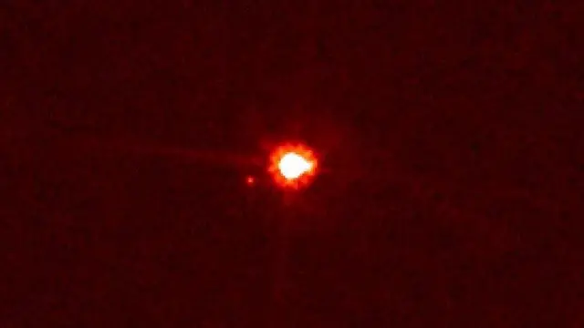 Image of dwarf planet Eris and its satellite Dysnomia captured in 2005 by the Hubble telescope