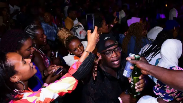 Revellers are seen at Levels Lounge after Uganda's president Yoweri Museveni reopened the economy, January 31, 2022.