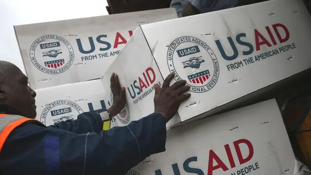 Workers unload medical supplies to fight the Ebola epidemic from a USAID cargo flight on 24 August 2014 in Harbel, Liberia