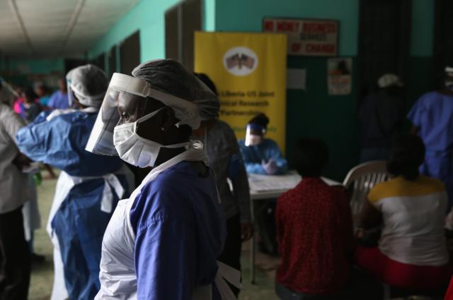 A nurse in protective clothing at the Ebola holding centre in Monrovia, Liberia (February 2015)