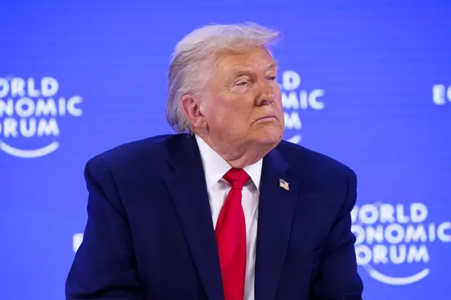 Donald Trump Dünya Ekonomik Forumu'nda otururken.