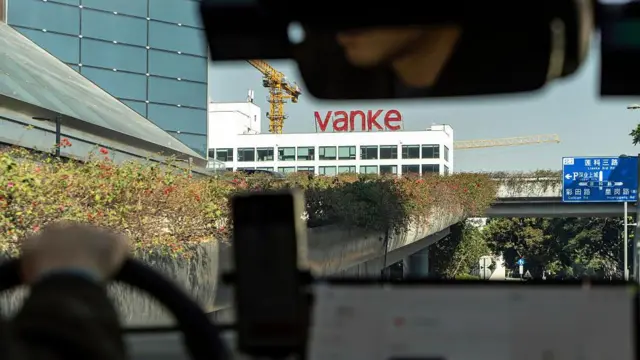 Signage for China Vanke Co. atop a building in Shenzhen, China, on Wednesday, Jan. 14, 2026.