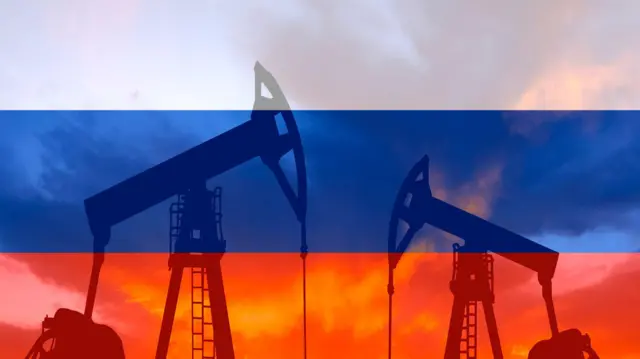 Нафтовий насос на тлі російського прапора