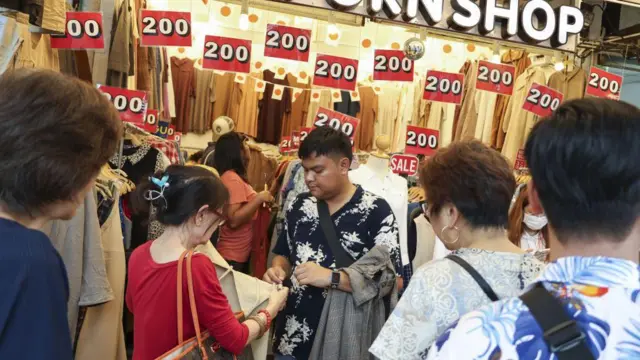 ustomers browse clothes at a store in Bangkok, Thailand, on Sunday, Oct. 29, 2023.