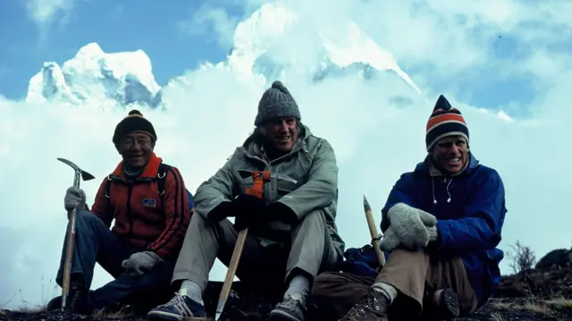 Edmund Hillary and Peter sitting in high Himalayas with Mingma Tsering 