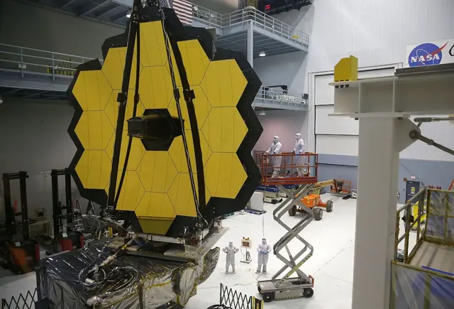 GREENBELT, MD - NOVEMBER 02: Engineers and technicians assemble the James Webb Space Telescope November 2, 2016 at NASA's Goddard Space Flight Center in Greenbelt, Maryland. The telescope, designed to be a large space-based observatory optimized for infrared wavelengths, will be the successor to the Hubble Space Telescope and the Spitzer Space Telescope. It is scheduled to be launched in October 2018. (Photo by Alex Wong/Getty Images)
