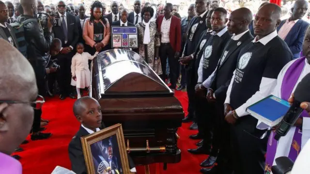 Family members surround di coffin of Kenya marathon world record holder Kelvin Kiptum, wey die for road accident, during di funeral service for Chepkorio show ground, Elgeyo Marakwet County, Kenya for February 23, 2024
