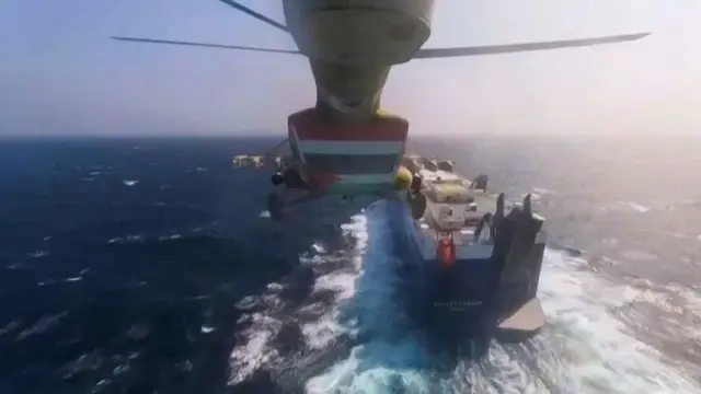 A Houthi helicopter approaches a ship