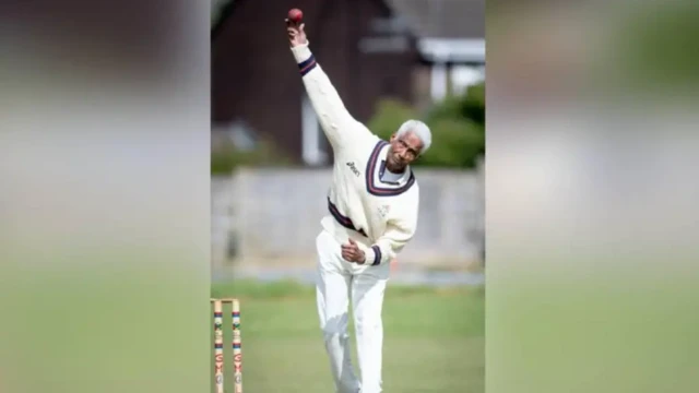 Cecil Wright, pictured bowling in his final game for Uppermill in 2019 at the age of 85