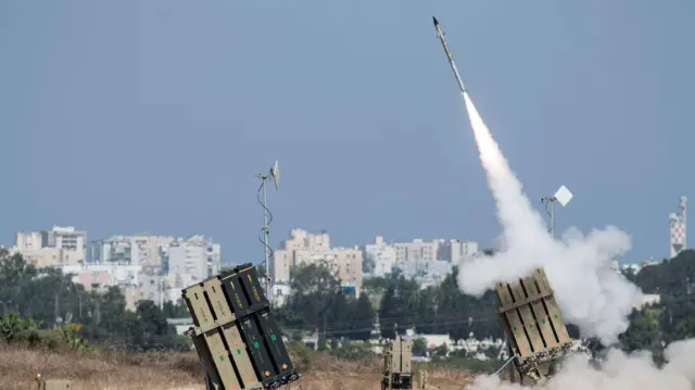 Iron Dome missiles being fired