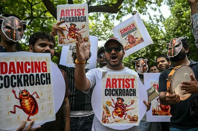 Cockroach Janta Party (CJP) supporters shout slogans during a protest over alleged irregularities in the country's major examinations, in New Delhi on June 6, 2026. Hundreds of young students gathered in New Delhi on June 6 for the first street protest by the satirical "Cockroach People's Party" over alleged irregularities in major examinations held in the country recently. (Photo by Arun SANKAR / AFP via Getty Images)