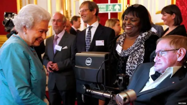 Britain"s Queen Elizabeth (L) meets Stephen Hawking during a reception for Leonard Cheshire Disability charity at St James"s Palace in London May 29, 2014.
