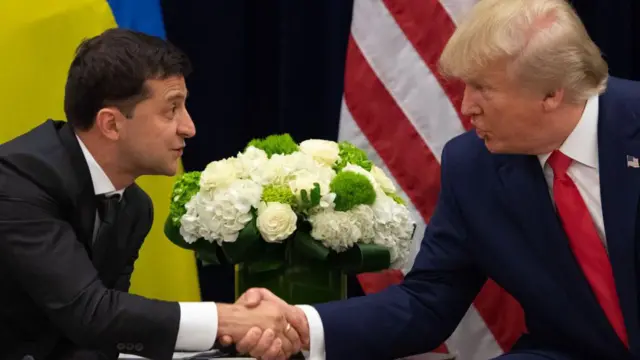 US President Donald Trump and Ukrainian President Volodymyr Zelensky shake hands during a meeting in New York on September 25, 2019,